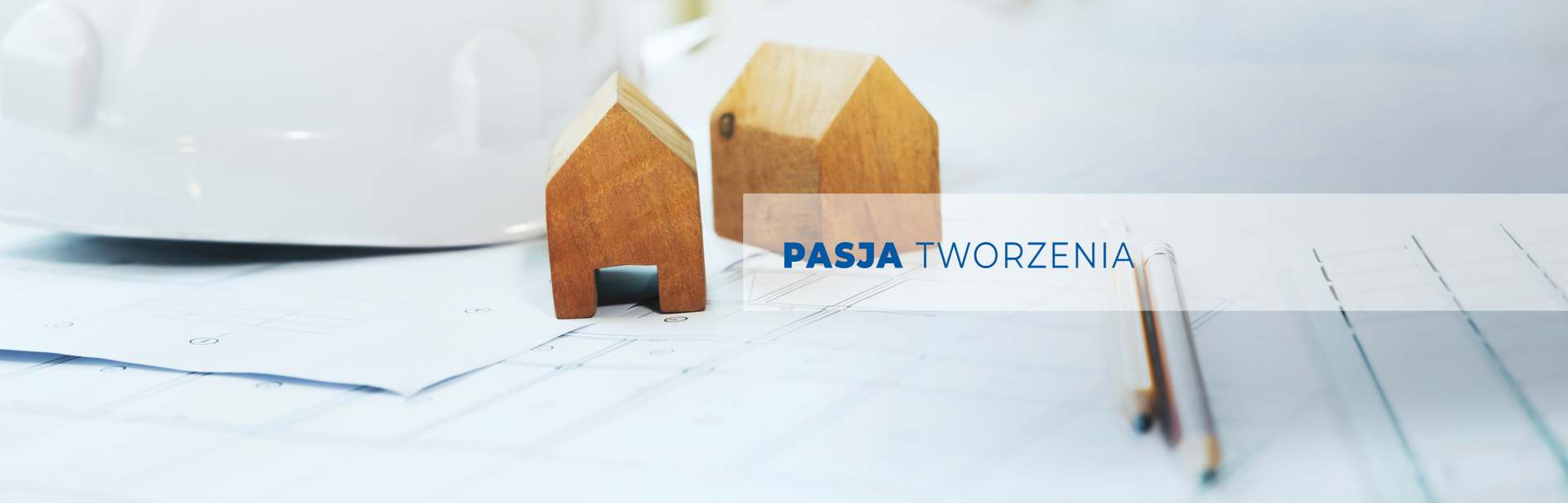 Slajd 2 - dwa szkielety wieżowców z dźwigiem